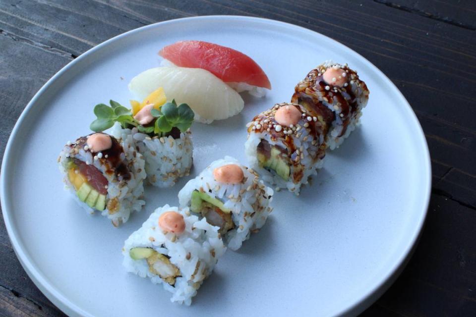 Salmon and yellowtail sashimi, Spicy Tuna Roll (left), Shrimp Tempura roll (right), at Soy Cowboy at Loews Hotel in Arlington.