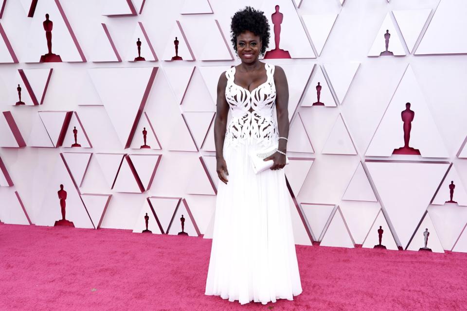 Viola Davis in a white, lacy long dress from Alexander McQueen.