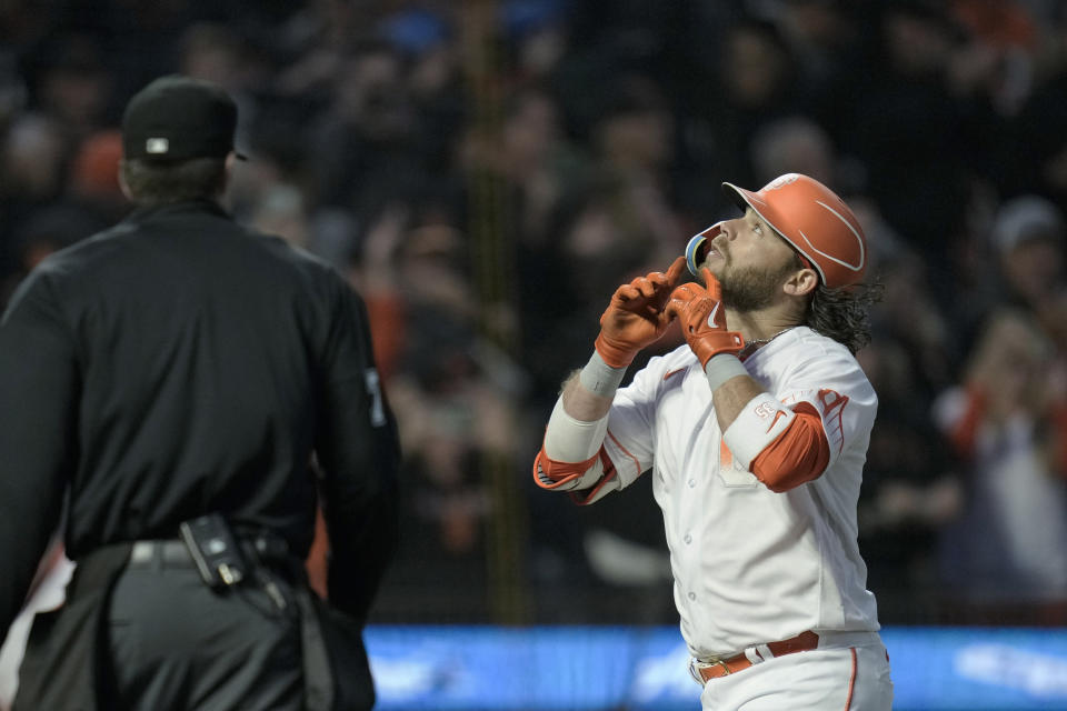 San Francisco Giants' Brandon Crawford, right, celebrates after hitting a two-run home run against the Arizona Diamondbacks during the sixth inning of a baseball game Tuesday, Aug. 1, 2023, in San Francisco. (AP Photo/Godofredo A. Vásquez)