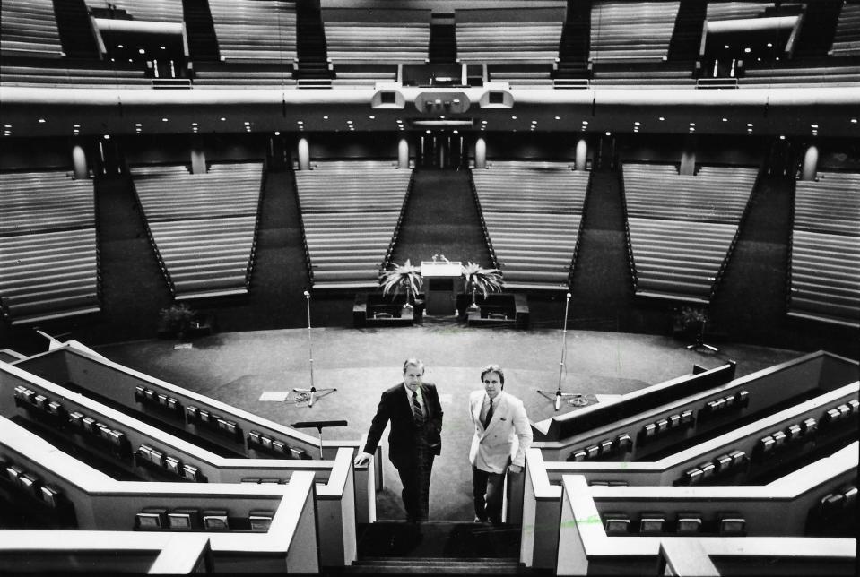 The Rev. Charles F. Billington and his son Dallas stand inside the new building at Akron Baptist Temple on Aug. 31, 1984.