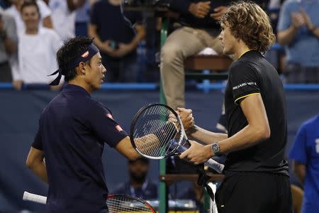 Aug 5, 2017; Washington, DC, USA; Alexander Zverev of Germany (R) shakes hands with Kei Nishikori of Japan (L) after their match in a men's singles semifinal at Fitzgerald Tennis Center. Mandatory Credit: Geoff Burke-USA TODAY Sports