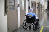 An inmate sits in a cellblock which mainly houses prisoners with cognitive decline, Alzheimer's, and dementia, at the California Health Care Facility in Stockton, California, U.S., May 24, 2018. REUTERS/Lucy Nicholson