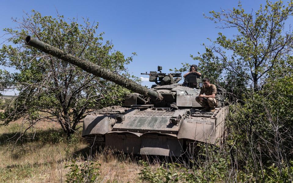 Ukrainian soldiers wait for orders during a training session