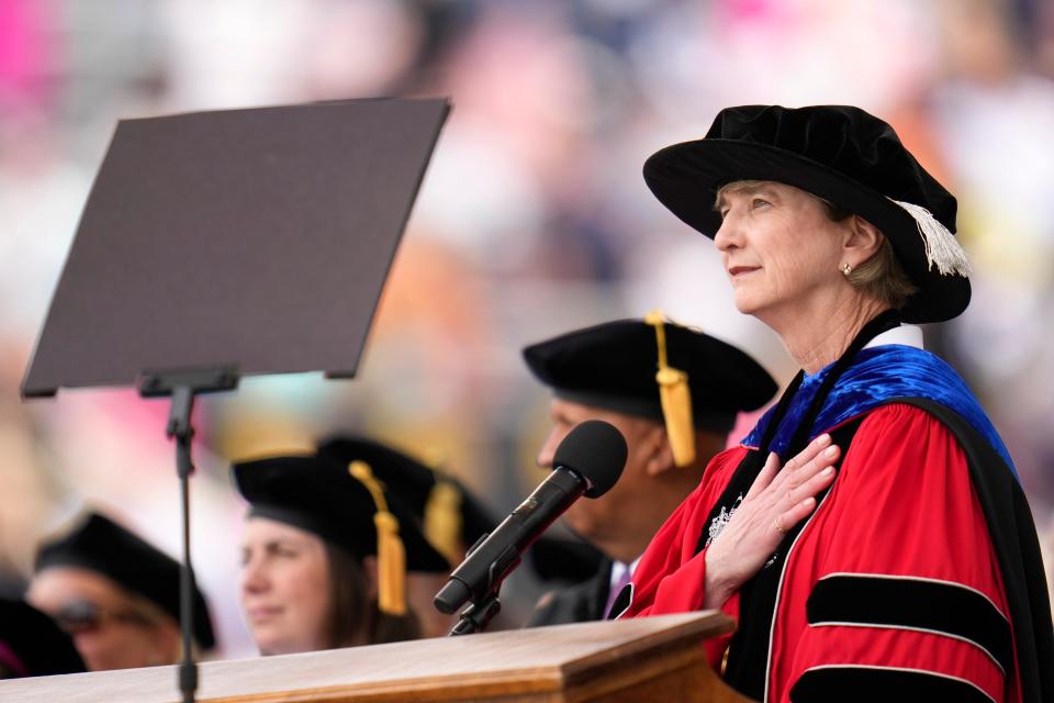May 7, 2023; Columbus, Ohio, United States;  Ohio State University President Kristina M. Johnson holds her hand above her heart during the playing of the national anthem during Ohio State Spring Commencement ceremonies at Ohio Stadium. Mandatory Credit: Joseph Scheller-The Columbus Dispatch