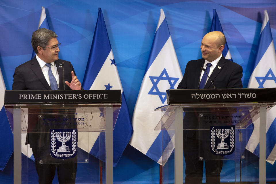 Israeli Prime Minister Naftali Bennett, right, and Honduran President Juan Orlando Hernandez, give statements at the prime minister's office, in Jerusalem, Thursday, June 24, 2021. (Heidi Levine/Pool via AP).