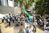 <p>People protest against the 2020 Tokyo Summer Olympic Games on July 23, 2020 in Tokyo, Japan, as Tokyo Metropolitan Government celebrates the finale of the Olympic Torch Relay at its final destination after 15 days of its journey around Tokyo city a few hours ahead of the Opening ceremony of 2020 Tokyo Summer Olympic Games. (Photo by David MAREUIL/Anadolu Agency via Getty Images)</p> 