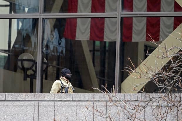 A National Guard soldier stands outside a balcony at the Hennepin County Government Center, where the Chauvin trial is being held.