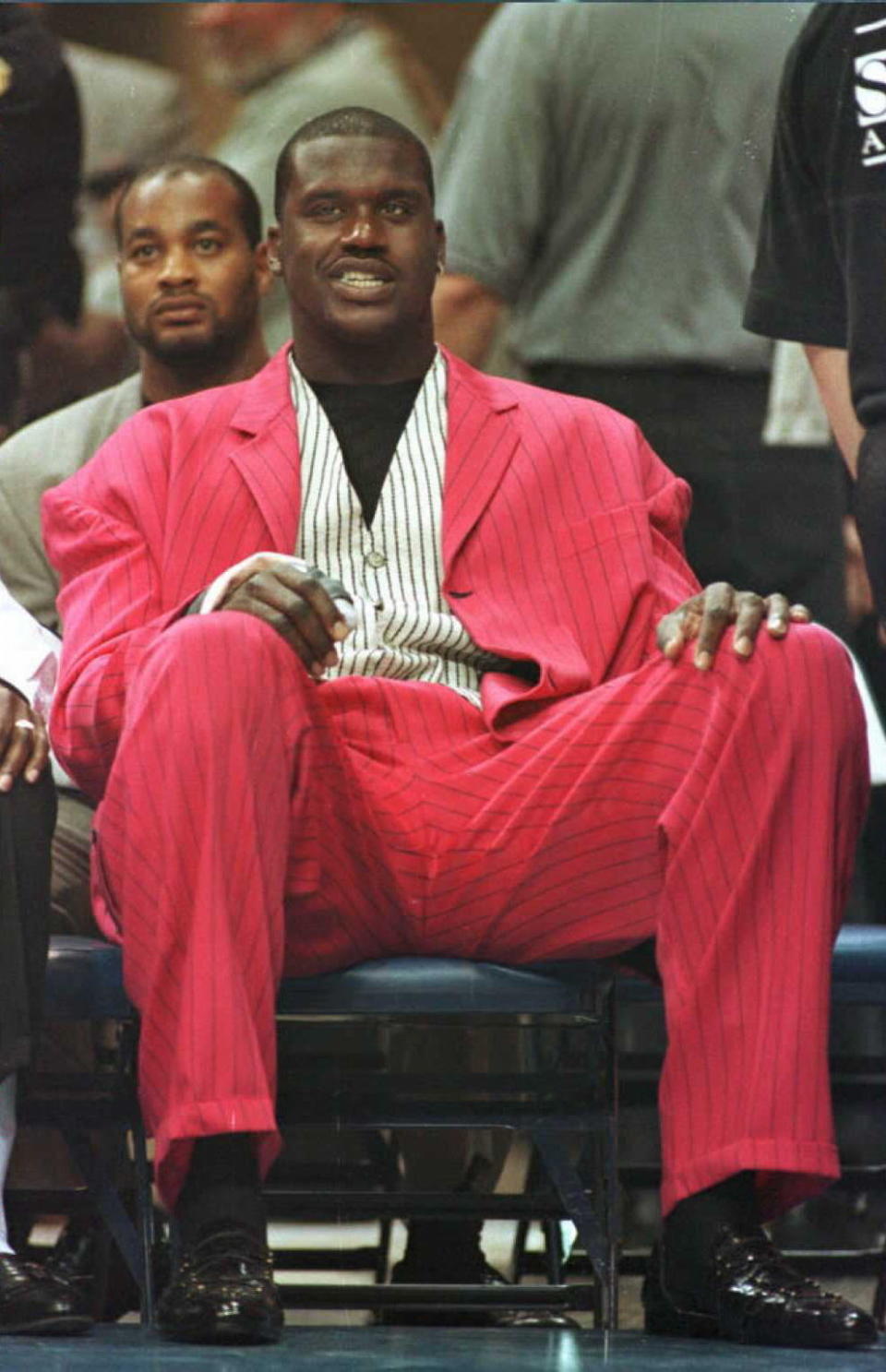 Shaquille O'Neal sits on the bench during the opening game of the Magic's NBA season with the Cleveland Cavaliers at the Orlando Arena. O'Neal was recovering from a broken right thumb sustained during a preseason game with the Miami Heat. (TONY RANZE/AFP/Getty Images)