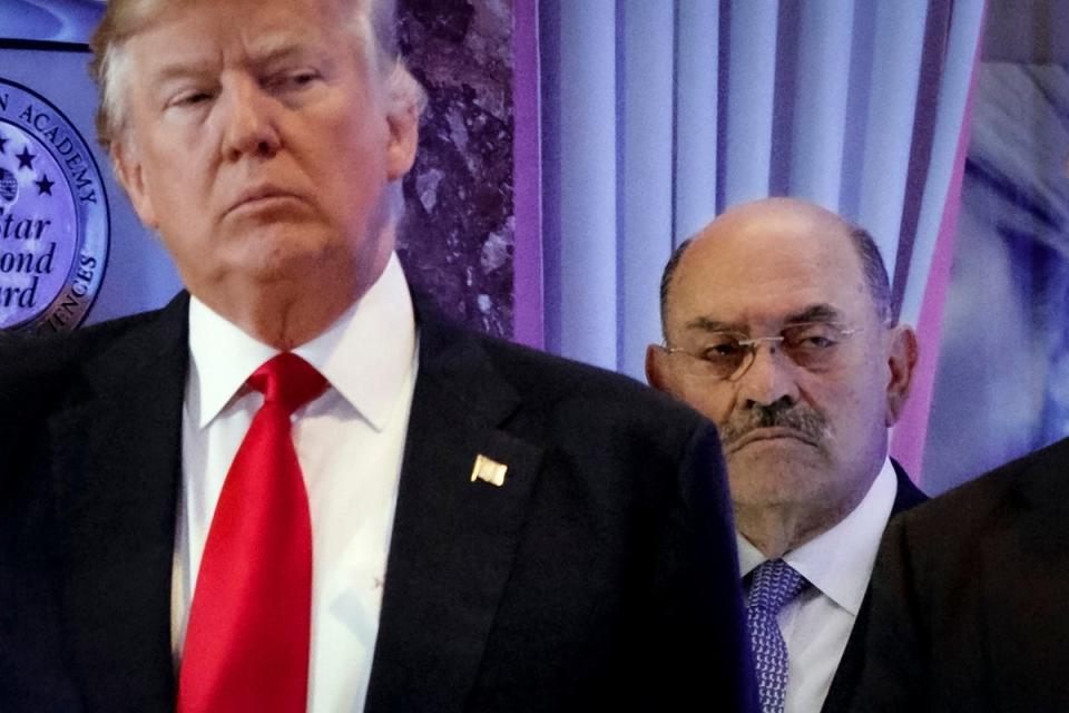 Allen Weisselberg, right, stands behind then President-elect Donald Trump during a news conference in the lobby of Trump Tower in New York, Jan. 11, 2017. (AP)