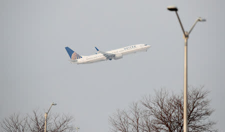 FILE PHOTO: A United Airlines Boeing 737-900ER plane departs from O'Hare International Airport in Chicago, Illinois, U.S. November 30, 2018. REUTERS/Kamil Krzaczynski/File Photo