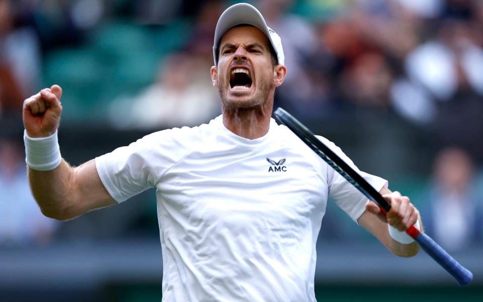 Great Britain's Andy Murray celebrates winning the third set during his second round match against USA's John Isner on centre court during day three - Steven Paston/PA