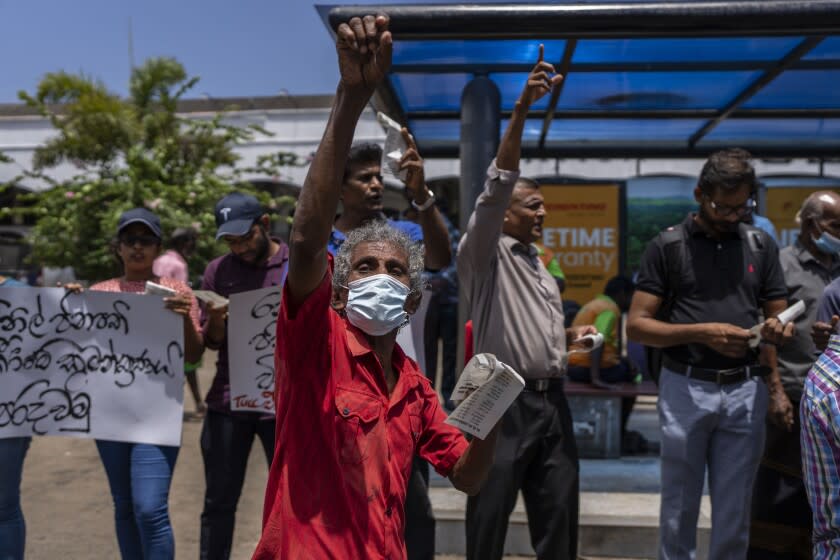 Trade union representatives and activists shout slogans during a protest against Sri Lanka's acting president Ranil Wickremesinghe in Colombo, Sri Lanka, Monday, July 18, 2022. Wickremesinghe on Monday declared a state of emergency giving him broad authority amid growing protests demanding his resignation two days before the country's lawmakers are set to elect a new president. (AP Photo/Rafiq Maqbool)