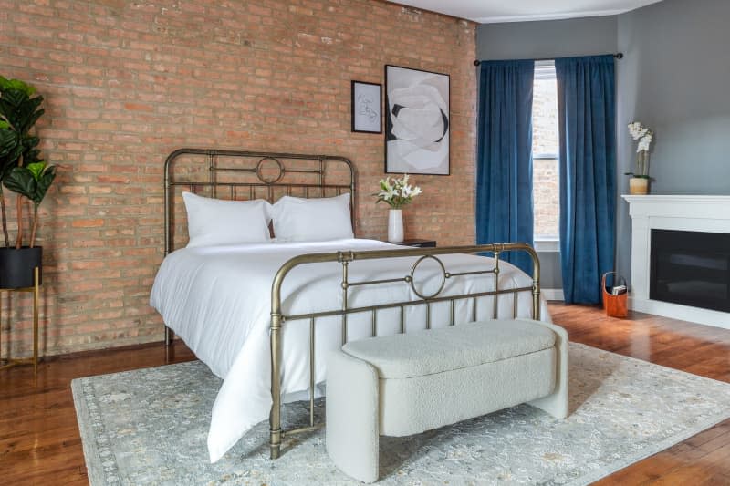 <span>Laveppia's Chicago bedroom. We styled the space with classic pieces from <a href="https://www.homedepot.com/b/Home-Decor/N-5yc1vZas6p" rel="nofollow noopener" target="_blank" data-ylk="slk:The Home Depot's home collection;elm:context_link;itc:0;sec:content-canvas" class="link ">The Home Depot's home collection</a> to create a "neutral" foundation before layering on distinctive styles. Credit: Photo: Sarah Crowley; Prop Stylist: Amanda Wolfson</span> <span class="copyright">Credit: Photo: Sarah Crowley; Prop Stylist: Amanda Wolfson</span>