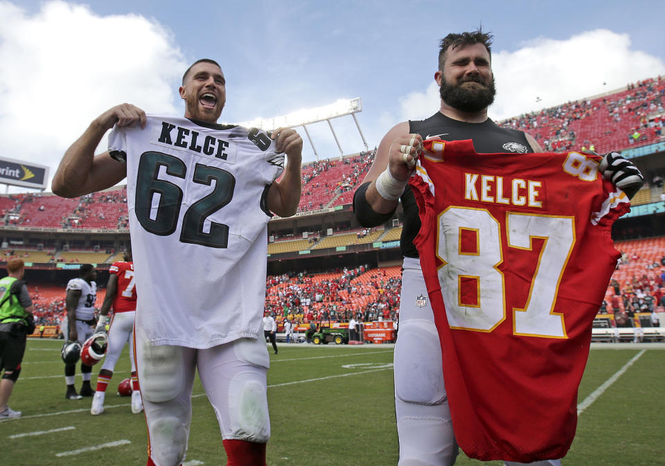 Kansas City Chiefs tight end Travis Kelce, left, and his brother Philadelphia Eagles center Jason Kelce, right, exchange jerseys after their NFL football game Sunday, Sept. 17, 2017, in Kansas City, Mo. The Chiefs won 27-20. (AP Photo/Charlie Riedel)