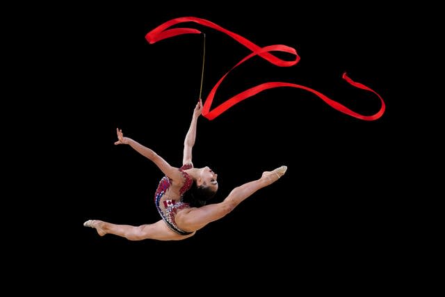 Rhythmic gymnast Suzanna Shahbazian produces a mesmerising performance as she competes at the Commonwealth Games in Birmingham. The Canadian, along with Tatiana Cocsanova and Carmel Kallemaa, took home gold from the all-round team event. She also won silver in the individual ball discipline