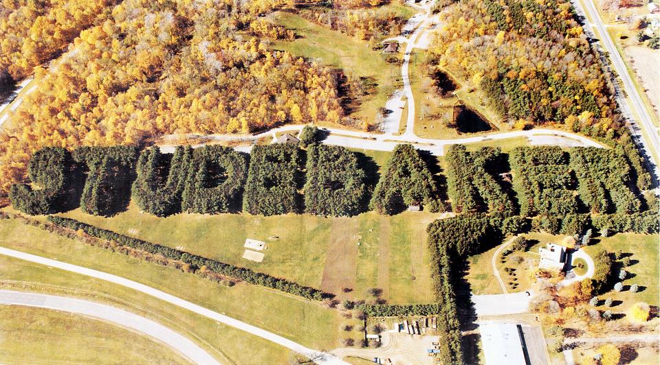 The Studebaker Corp's sign formed by pine trees at Bendix Woods County Park in New Carlisle is seen from the air in this undated photo.