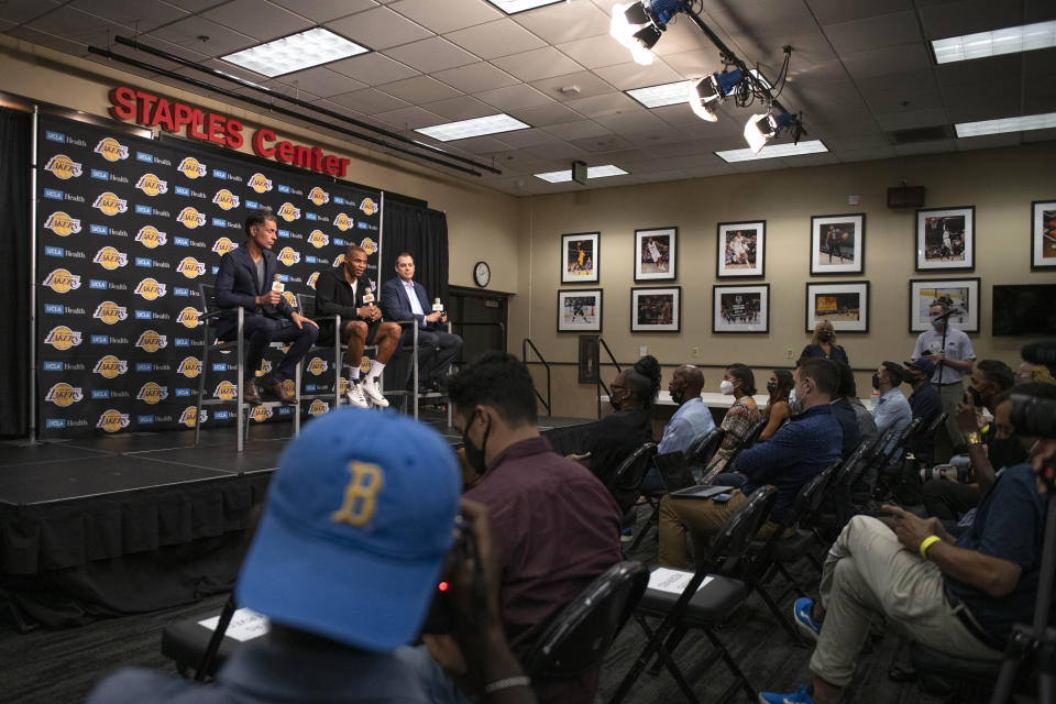 Los Angeles Lakers guard Russell Westbrook, on stage at center, speaks during his introductory NBA basketball news conference in Los Angeles, Tuesday, Aug. 10, 2021. (AP Photo/Kyusung Gong)