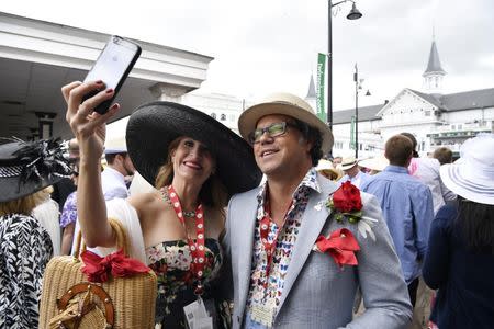 May 6, 2017; Louisville , KY, USA; Joe and Heather Cribbins take a selfie in the paddock area in their derby hats before the 2017 Kentucky Derby at Churchill Downs. Mandatory Credit: Jamie Rhodes-USA TODAY Sports