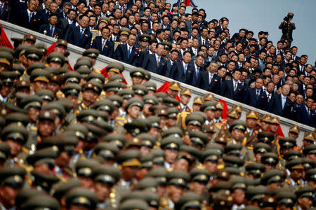 FILE PHOTO: A soldier films North Korean soldiers, officers and high ranking officials attending a military parade marking the 105th birth anniversary of country's founding father Kim Il Sung in Pyongyang, North Korea, April 15, 2017. REUTERS/Damir Sagolj/File Photo