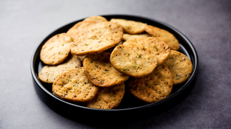 Rajasthani mathri on black plate