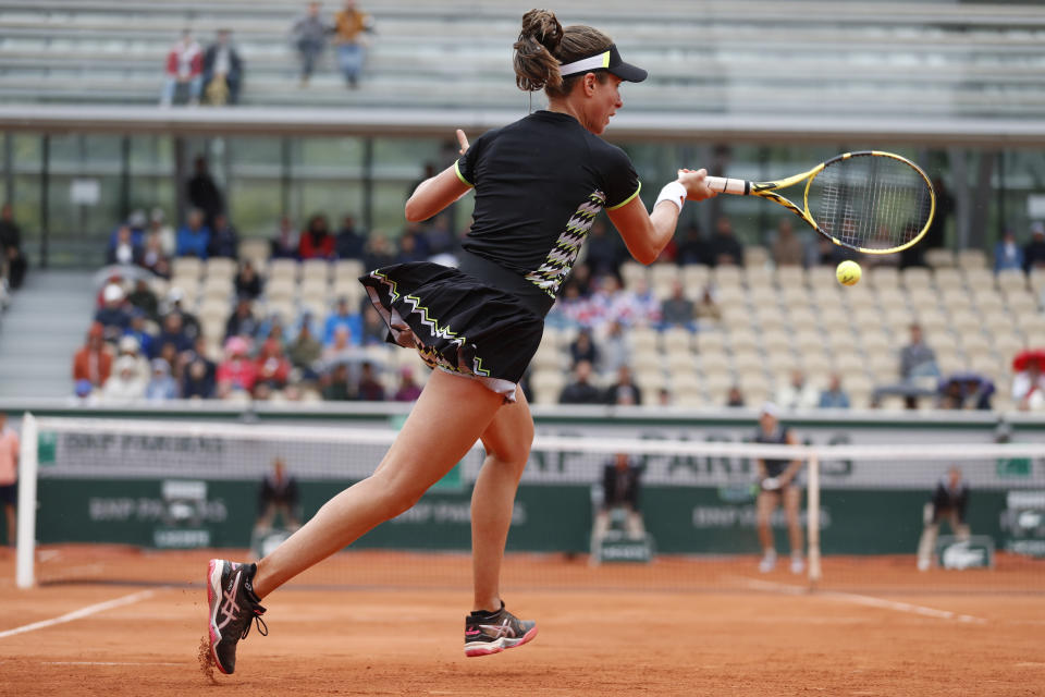 Britain's Johanna Konta plays a shot against Marketa Vondrousova of the Czech Republic during their semifinal match of the French Open tennis tournament at the Roland Garros stadium in Paris, Friday, June 7, 2019. (AP Photo/Jean-Francois Badias)