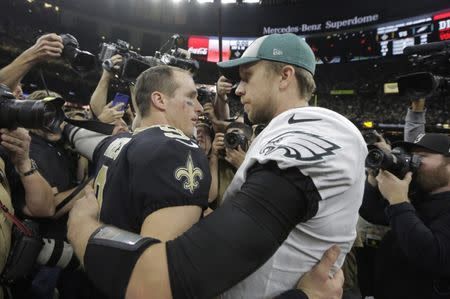 Jan 13, 2019; New Orleans, LA, USA; New Orleans Saints quarterback Drew Brees (9) and Philadelphia Eagles quarterback Nick Foles (9) meet after a NFC Divisional playoff football game at Mercedes-Benz Superdome. The Saints won 20-14. Mandatory Credit: Derick E. Hingle-USA TODAY Sports