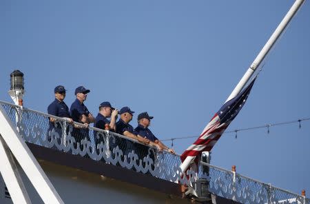 July 23, 2018; Branson, MO, USA; Using a barge mounted crane, a salvage crew from Fitzco Marine Group begin the process of raising a duck boat from below the surface of Table Rock Lake on Monday, July 23, 2018. 17 people were killed last week when the duck boat sank. Mandatory Credit: Nathan Papes/News-Leader via USA TODAY NETWORK