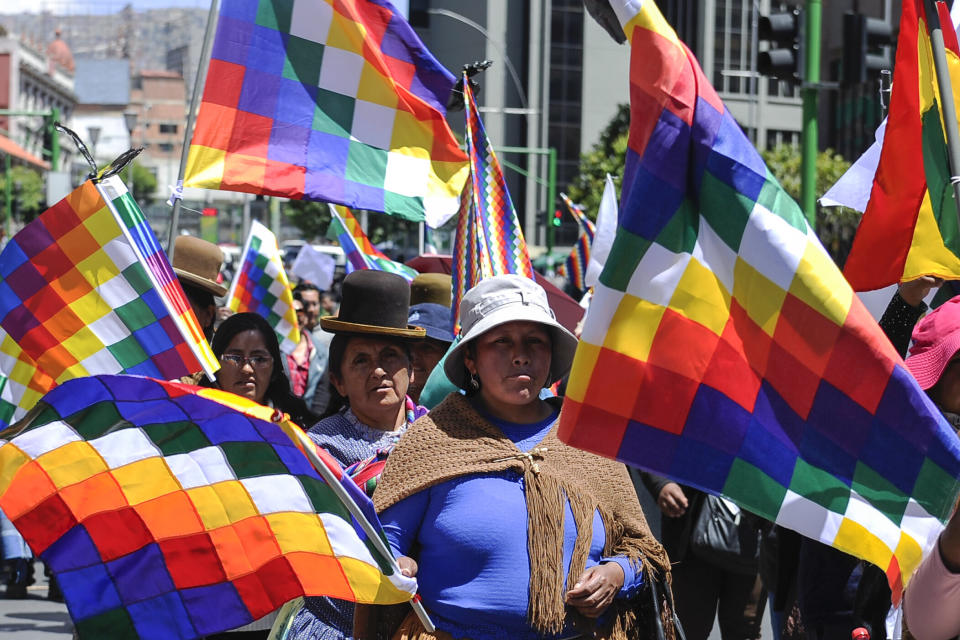 Supporters of Evo Morales carry Wiphala flags that represent Indigenous peoples in La Paz on Nov. 18, 2019. (Photo: JORGE BERNAL via Getty Images)