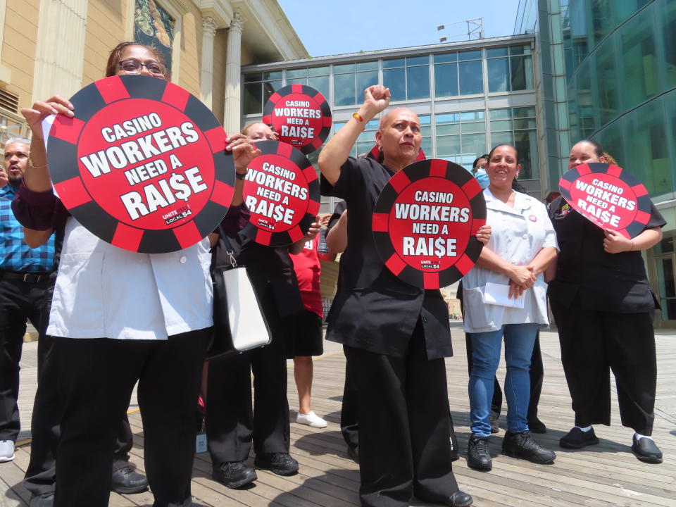 Casino housekeeping workers hold a press conference on the Atlantic City, N.J., Boardwalk on Wednesday, June 8, 2022 at which they accused four casinos of failing to clean each occupied hotel room daily as required by an executive order from New Jersey's governor. (AP Photo/Wayne Parry)