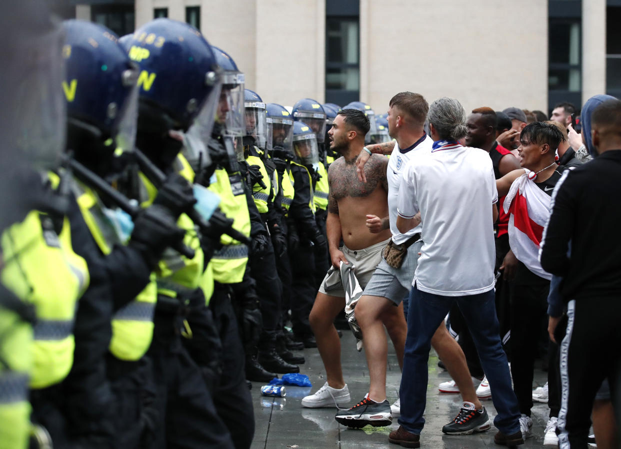 England football fans clash with police outside Wembley stadium during England v Italy Euro 2020 finals on 11 July. Photo: Peter Cziborra/Reuters