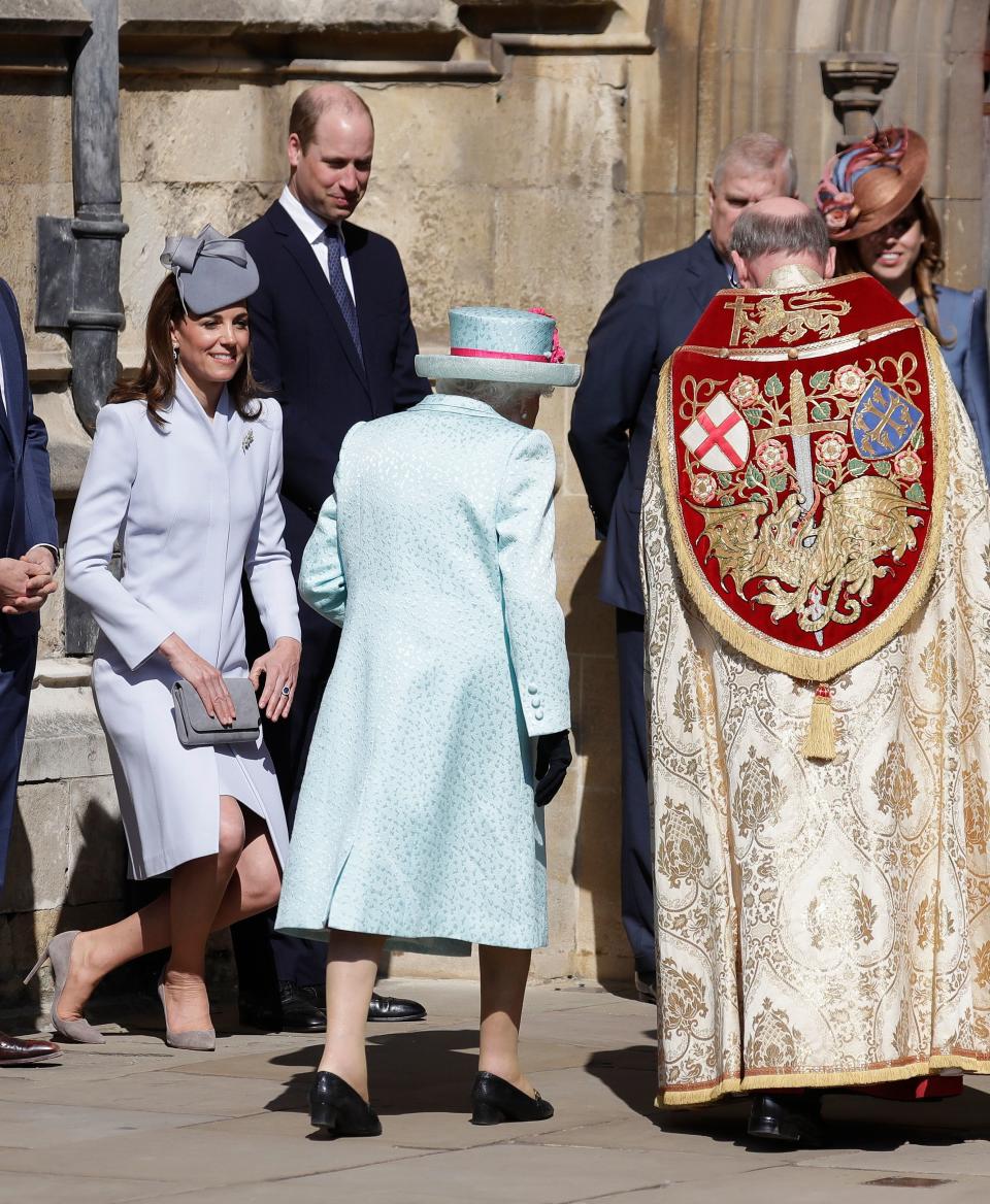 The Duchess of Cambridge curtsies to the Queen as she arrives for the Easter Sunday service [Photo: Getty]