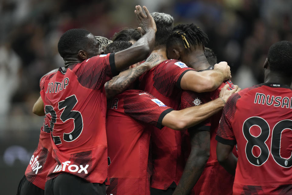 AC Milan's players celebrate after Christian Pulisic scored his side's opening goal during a Serie A soccer match between AC Milan and Lazio, at the San Siro stadium in Milan, Italy, Saturday, Sept. 30, 2023. (AP Photo/Luca Bruno)