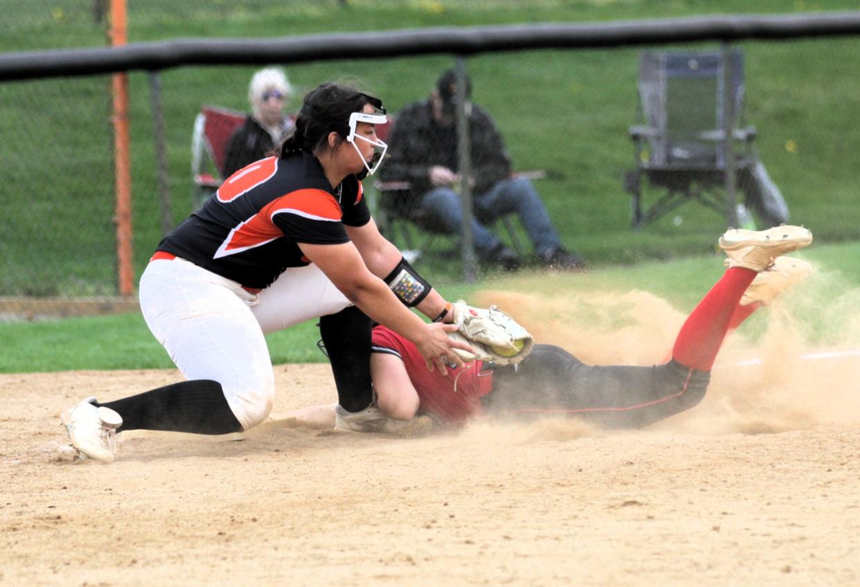 Riley Northrop puts the tag on a Paw Paw base runner at third base on Tuesday.