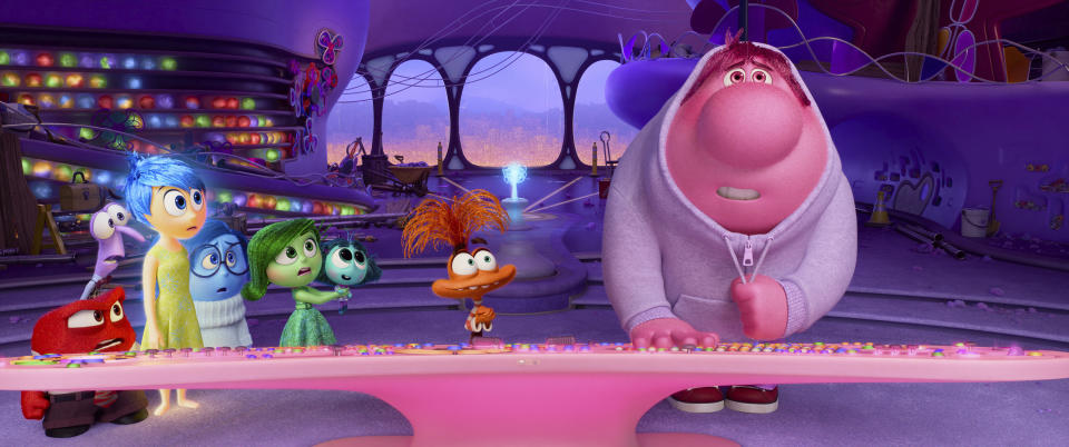 This image released by Disney/Pixar shows, from left, Anger, voiced by Lewis Black, Fear, voiced by Tony Hale, Joy, voiced by Amy Poehler, Sadness, voiced by Phyllis Smith, Disgust, voiced by Liza Lapira, Envy, voiced by Ayo Edebiri, Anxiety, voiced by Maya Hawke and Embarrassment, voiced by Paul Walter Hauser, in a scene from "Inside Out 2." (Disney/Pixar via AP)