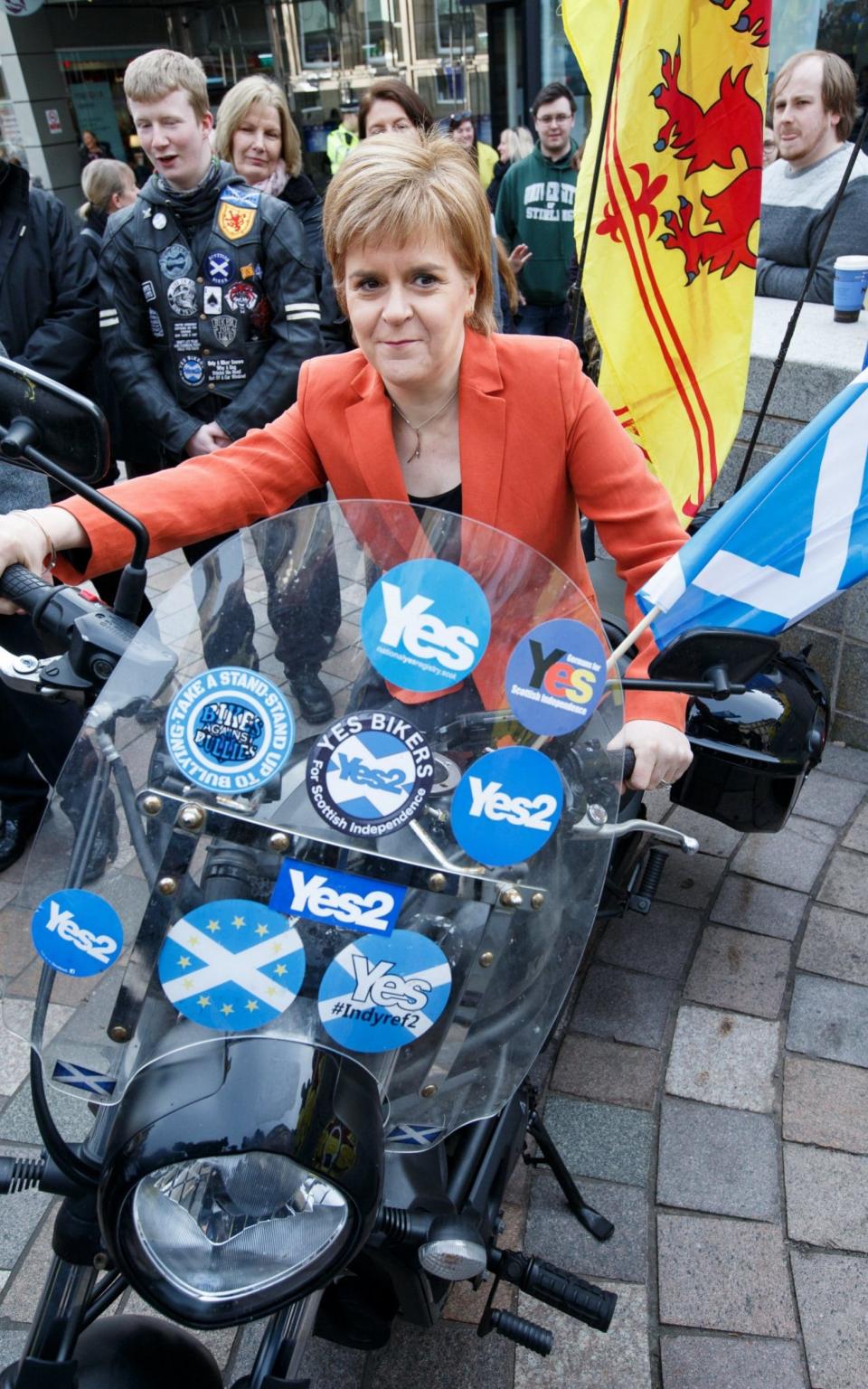 SNP leader Nicola Sturgeon poses on a motorcycle while on the campaign trail, in Stirling - Credit: EPA