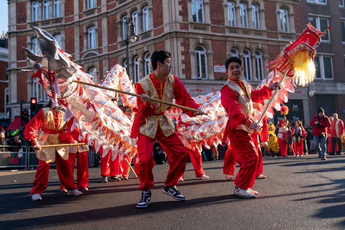22 January 2023: Performers taking part in a parade involving costumes, lion dances and floats, during Chinese New Year celebrations in London (PA)