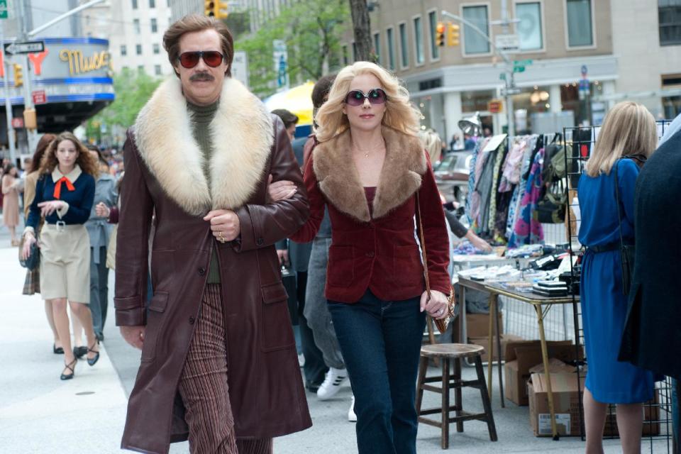 This film publicity image released by Paramount Pictures shows Will Ferrell as Ron Burgundy, left, and Christina Applegate as Veronica Corningstone in a scene from "Anchorman 2: The Legend Continues." (AP Photo/Paramount Pictures, Gemma LaMana)