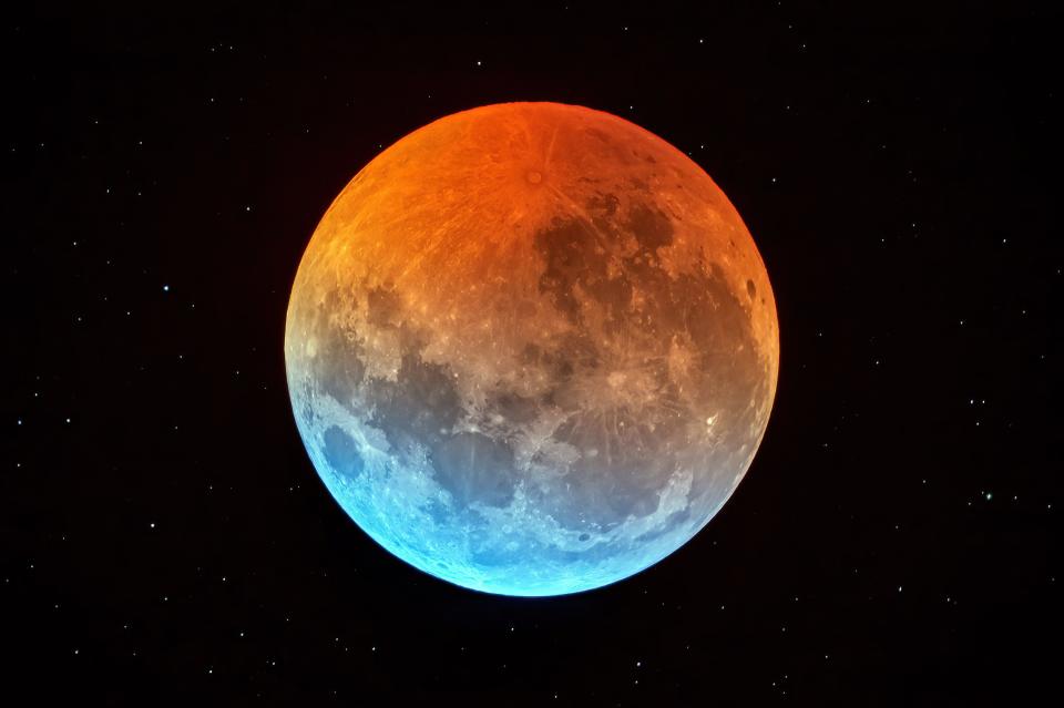 The full moon is totally within Earth's shadow and glows with a dim orange color during the total lunar eclipse photographed early on the morning of Jan. 21, 2019. Another total eclipse of the moon visible from the southeastern United States is coming up March 14, 2025.