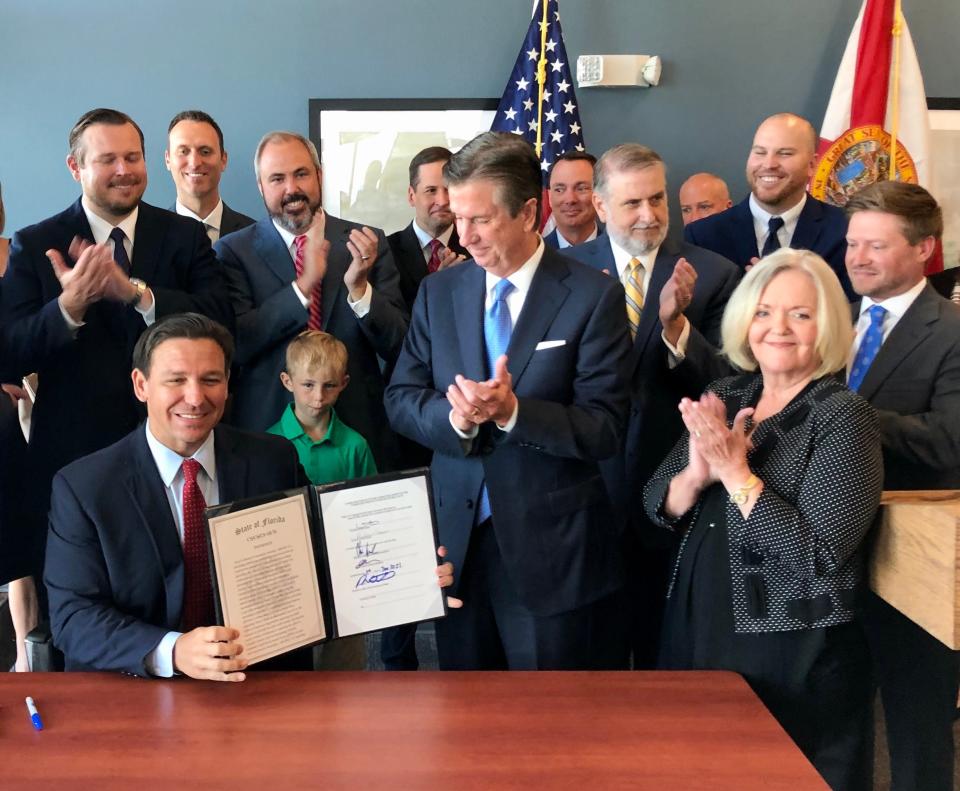 Gov. Ron DeSantis signed property insurance legislation in Sarasota on June 11.