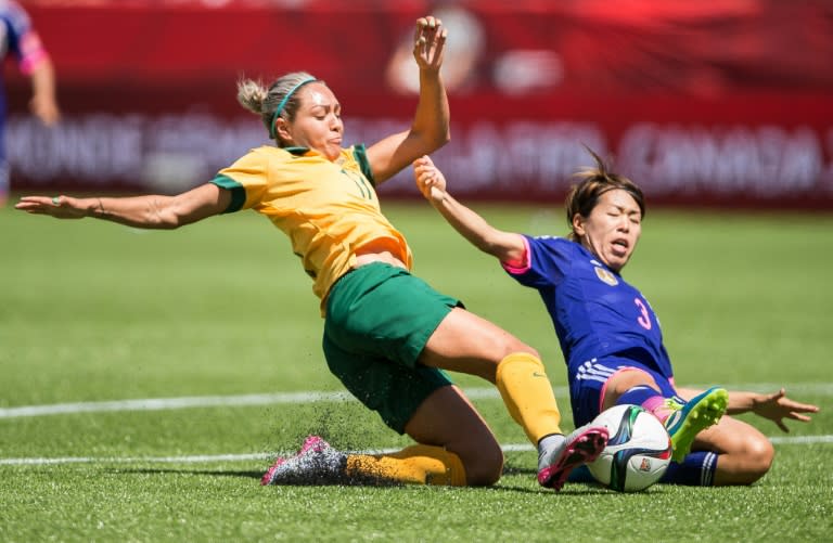 Australia's Kyah Simon and Japan's Azusa Iwashimizu vie for the ball during their quarter-final football match at the 2015 FIFA Women's World Cup in Edmonton, Alberta on June 27, 2015