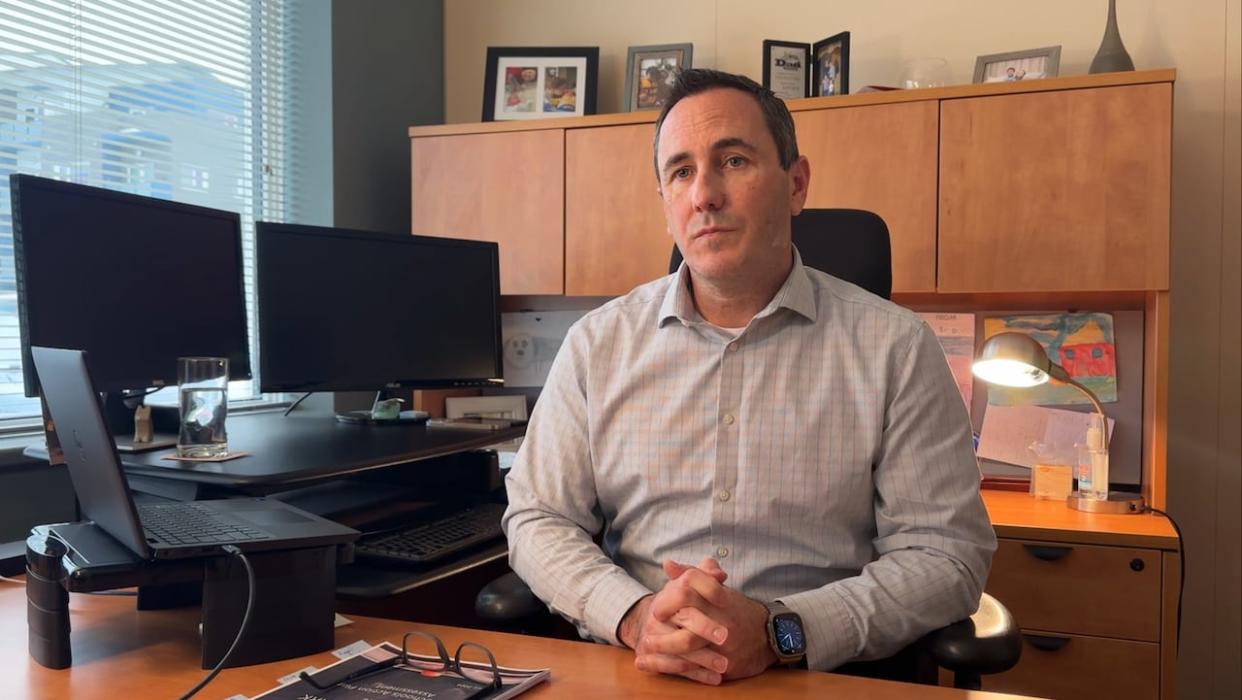 Yukon ombudsman Jason Pedlar in his Whitehorse office in February. This week, he delivered a report to the Legislative Assembly, outlining a number of ways to update the territory's Ombudsman Act. (Jackie Hong/CBC - image credit)