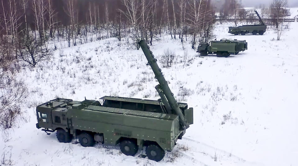 In this photo taken from video provided by the Russian Defense Ministry Press Service on Tuesday, Jan. 25, 2022, The Russian army's Iskander missile launchers take positions during drills in Russia. (Russian Defense Ministry Press Service via AP)