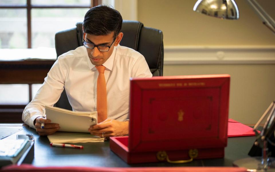 The Chancellor of the Exchequer, Rishi Sunak, prepares for his first Budget speech in his office in the Palace of Westminster in March  - HM Treasury/PA