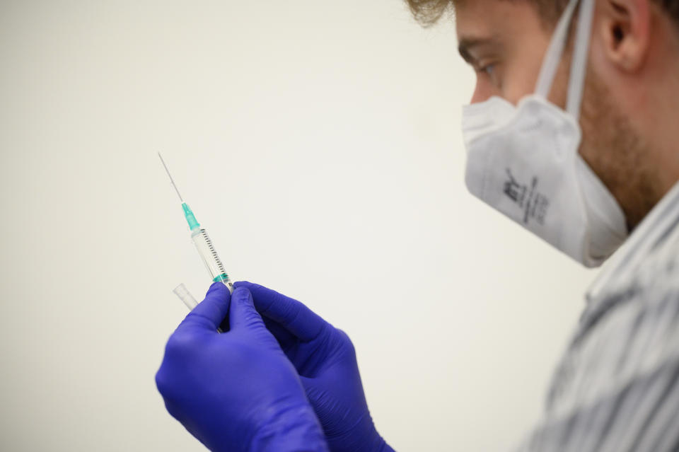 LONDON, ENGLAND - NOVEMBER 10: A member of the medical team prepares a series of doses of the Covid-19 vaccination booster jab at the Sir Ludwig Guttmann Health & Wellbeing Centre on November 10, 2021 in the Stratford area of London, England. Over 10 million people have now received their Covid-19 vaccine boosters in the UK, as the government has allowed people over 50 and the clinically vulnerable to receive third jabs. (Photo by Leon Neal/Getty Images)