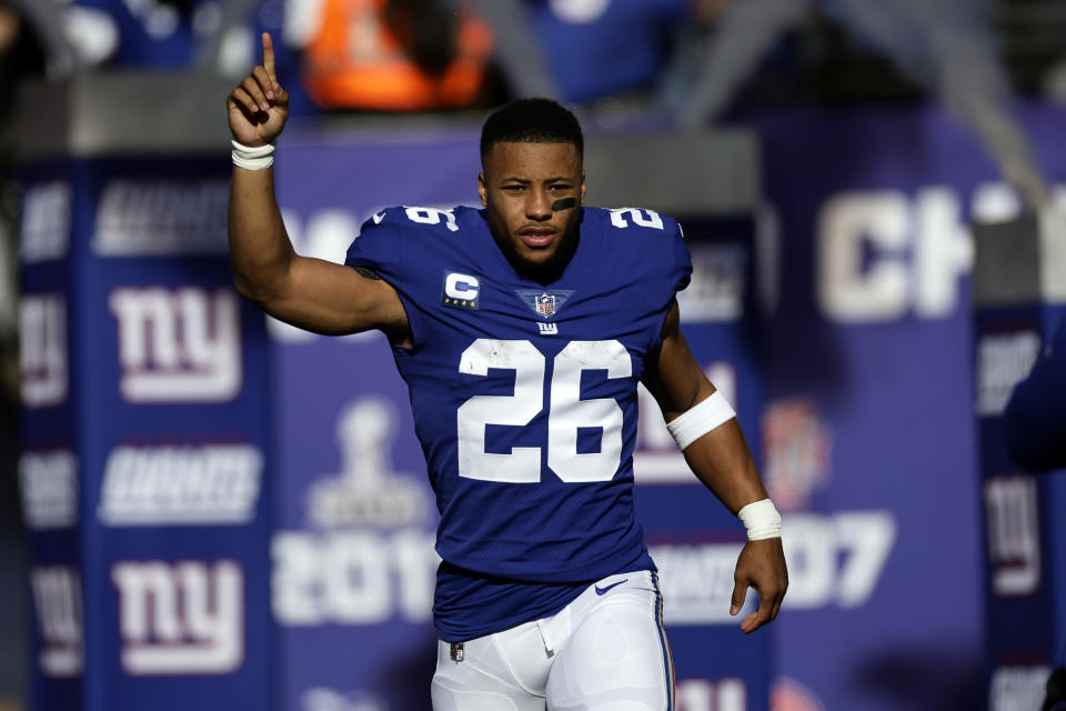 FILE - New York Giants running back Saquon Barkley is introduced before an NFL football game against the Indianapolis Colts, Jan. 1, 2023, in East Rutherford, N.J. Barkley and the Giants failed to reach an agreement on a long-term contract extension by the Monday, July 17, 2023, deadline for franchised players, leaving the star running back with the option of playing for the tag-mandated $10.1 million salary or maybe taking the season off. (AP Photo/Adam Hunger, File)