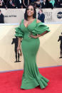<p>Nash flaunted her curves in a fitted green dress with flared sleeves. (Photo: Getty Images) </p>