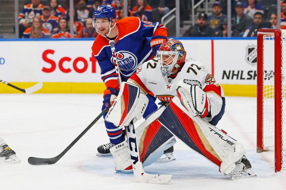 Edmonton Oilers forward Zach Hyman (18) looks for a pass beside Florida Panthers goaltender Sergei Bobrovsky (72) during a December game.