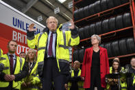 Britain's Prime Minister Boris Johnson talks during a question and answer session, part of a General Election campaign visit to Ferguson's Transport in Washington, England, Monday, Dec. 9, 2019. Chair of the Vote Leave Gisela Stuart, stands at right. Britain goes to the polls on Dec. 12. (Ben Stansall/Pool Photo via AP)