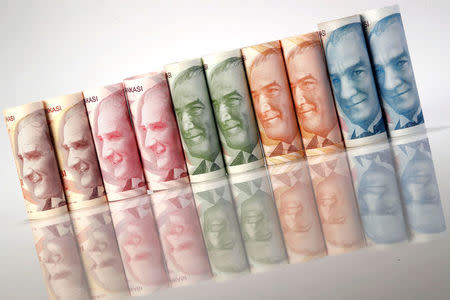 FILE PHOTO: Turkish Lira banknotes are seen in this October 10, 2017 picture illustration. REUTERS/Murad Sezer/Illustration/File Photo