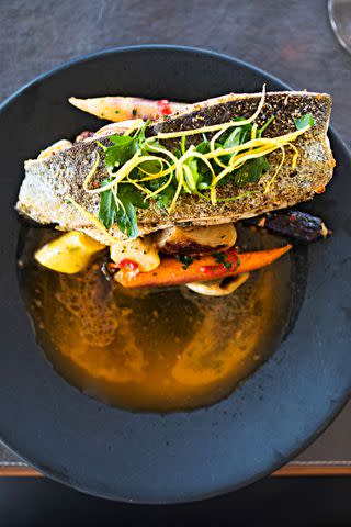 <p>CAMERON REYNOLDS</p> Sunburst Trout Farms fish at Oak Steakhouse, the restaurant at Skyline Lodge.